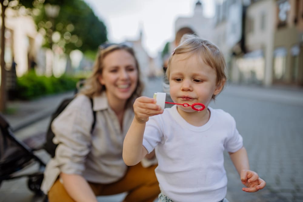 Image is of a mother spending time with her young child, representing parenting time in a parenting plan.